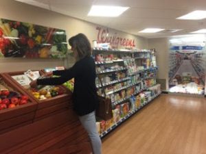 customer shopping a product display at the St. Luke's pharmacy